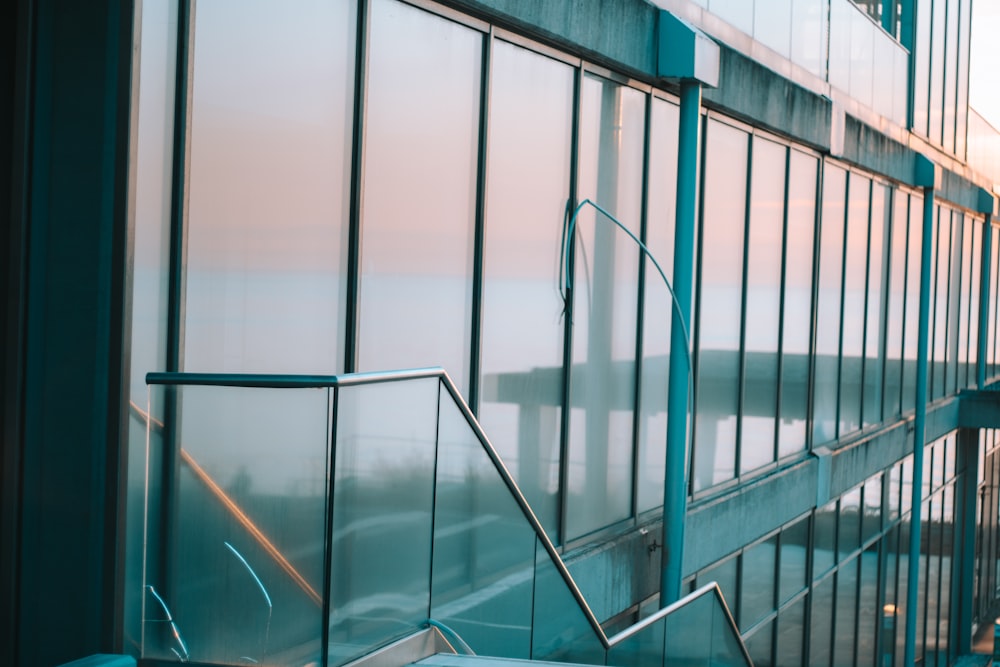 a building with glass walls and a railing