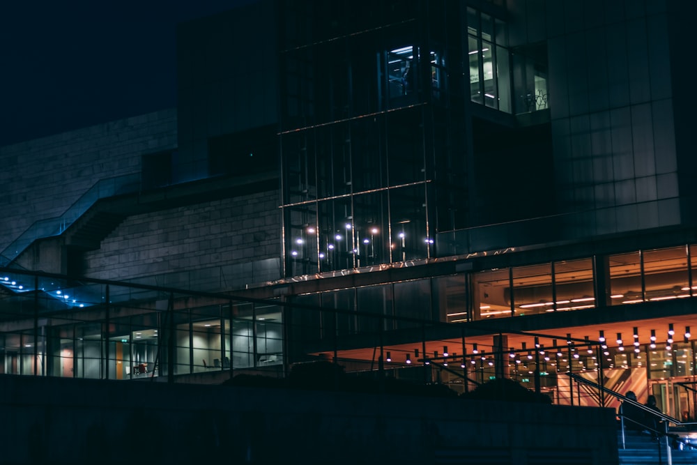 a building lit up with lights at night