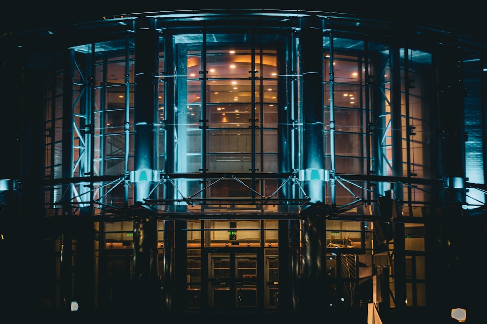 a large round building lit up at night