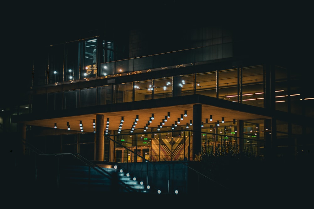 a building lit up with lights at night