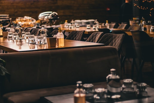 a restaurant filled with lots of tables and chairs