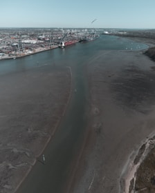 Aerial shot of a modern industrial port in Paranaguá with drones in action.