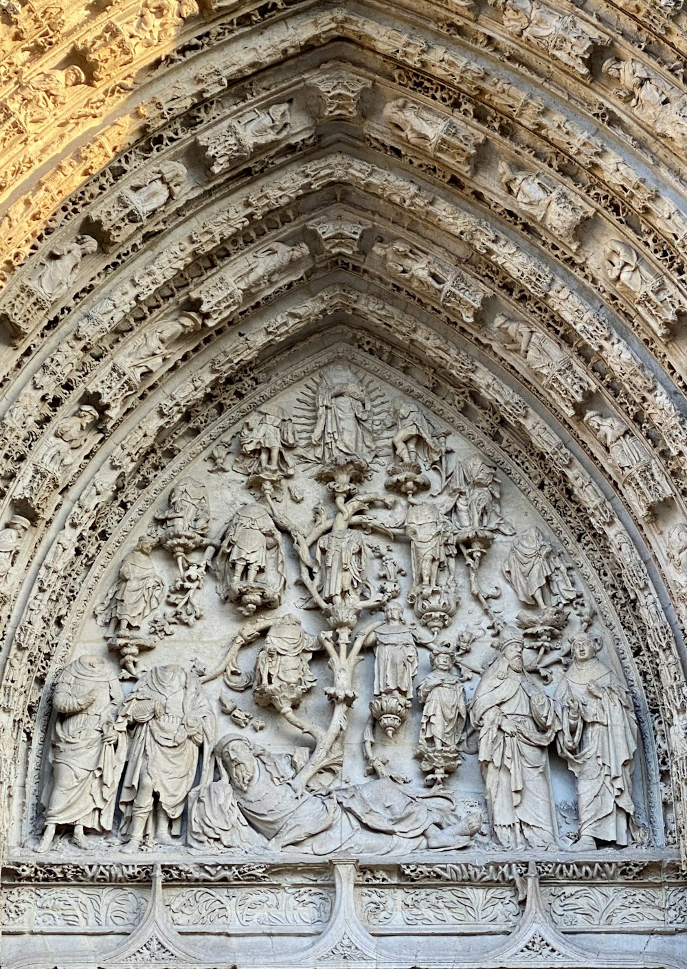 a close up of a stone arch with carvings on it