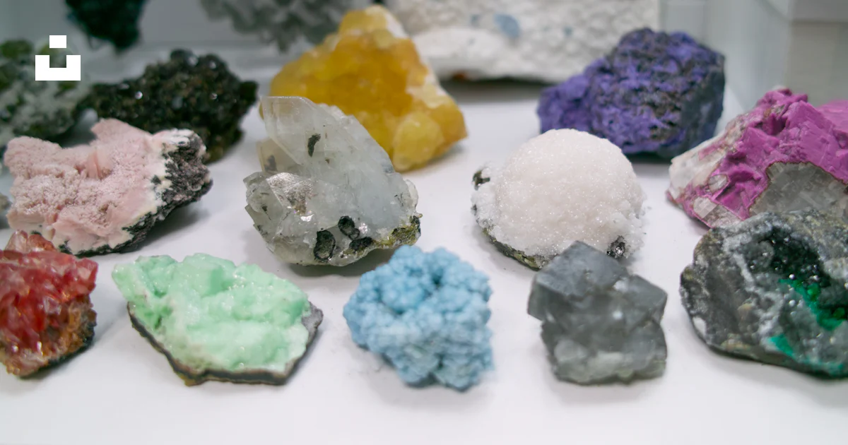A bunch of different colored rocks on a table photo – Free Mineral ...