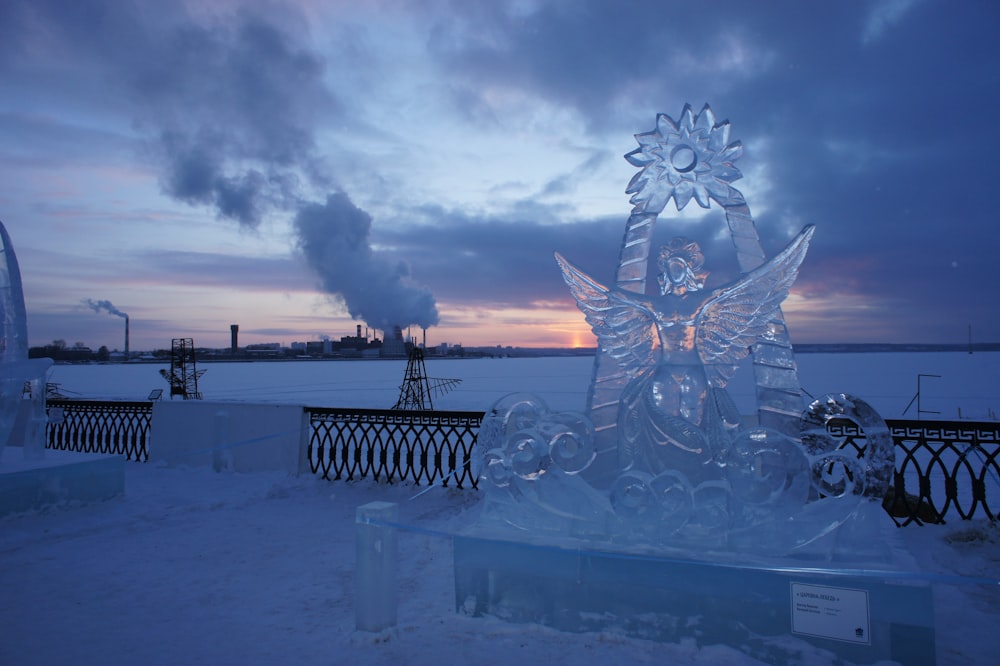 an ice sculpture of a woman with a flower on her head