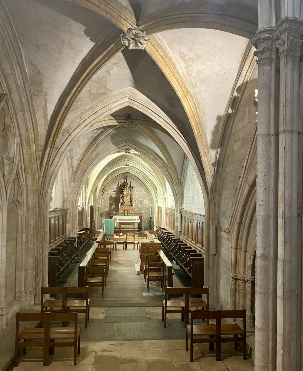 a church filled with wooden benches and pews