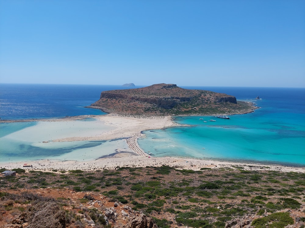 a beach with a mountain in the background