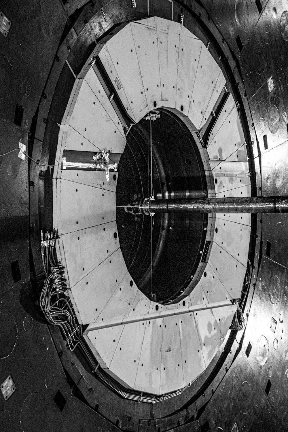 a large metal object with a clock on it's side