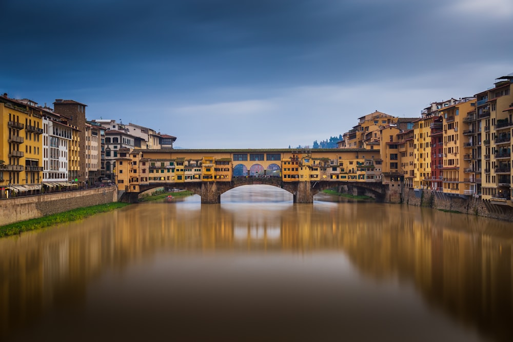 a river running through a city next to tall buildings