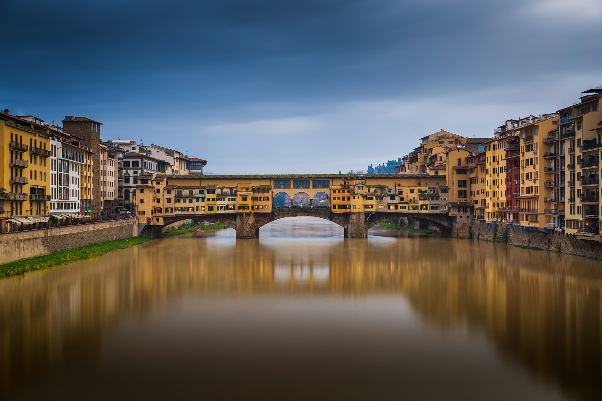 a river running through a city next to tall buildings
