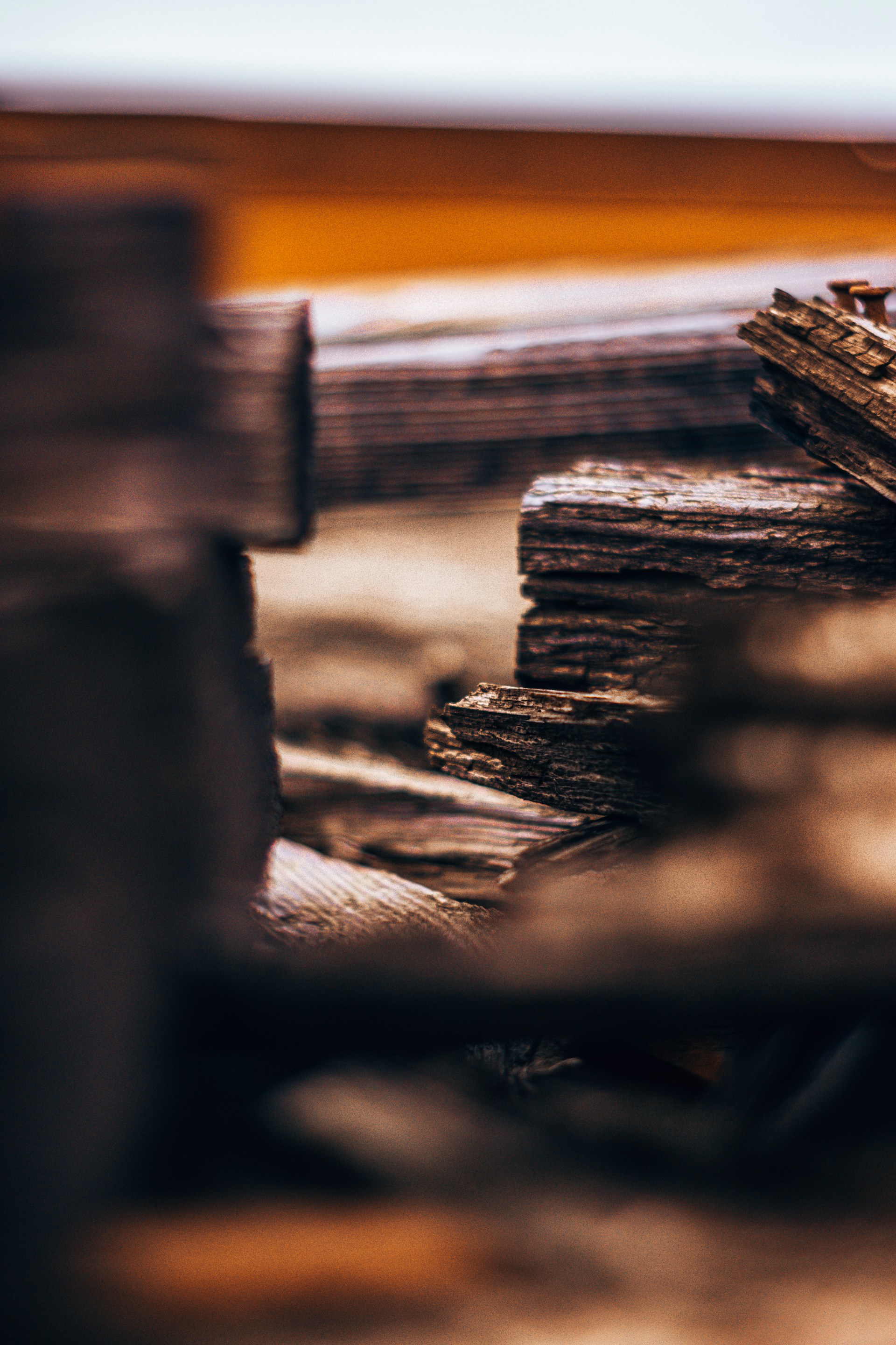 A close-up of rich, textured hardwood planks freshly cut and stacked, highlighting the natural grain and warmth of wern wood.