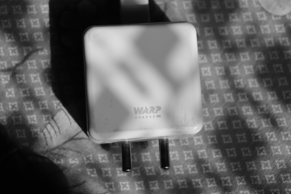 a black and white photo of a wall outlet