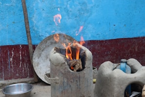 A family safely using the Agni Kawach in their kitchen during a fire drill.