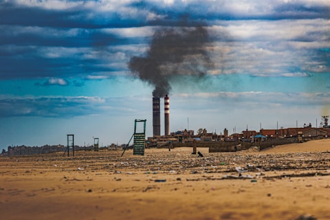 a factory with smoke coming out of it's stacks