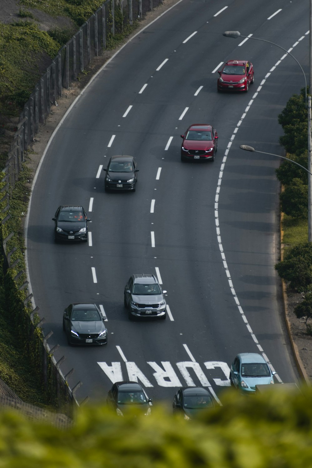 a group of cars driving down a highway