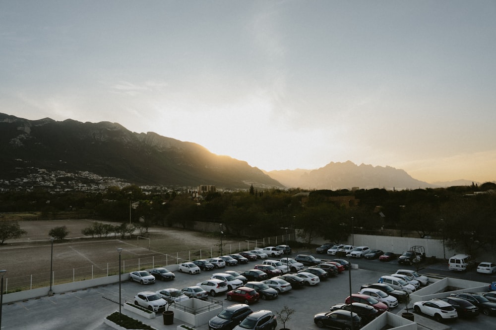 a parking lot filled with lots of parked cars