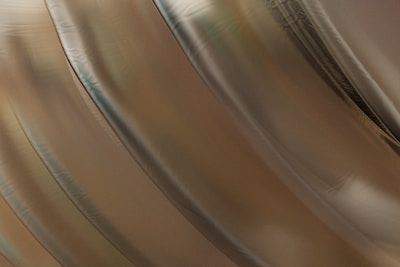 Close-up of shimmering metallic balloons twisted into intricate designs