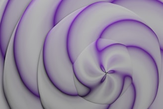 A digital abstract pattern featuring swirling, layered shapes with a smooth texture. The design combines shades of gray with subtle accents of purple, creating a gentle, flowing spiral effect.