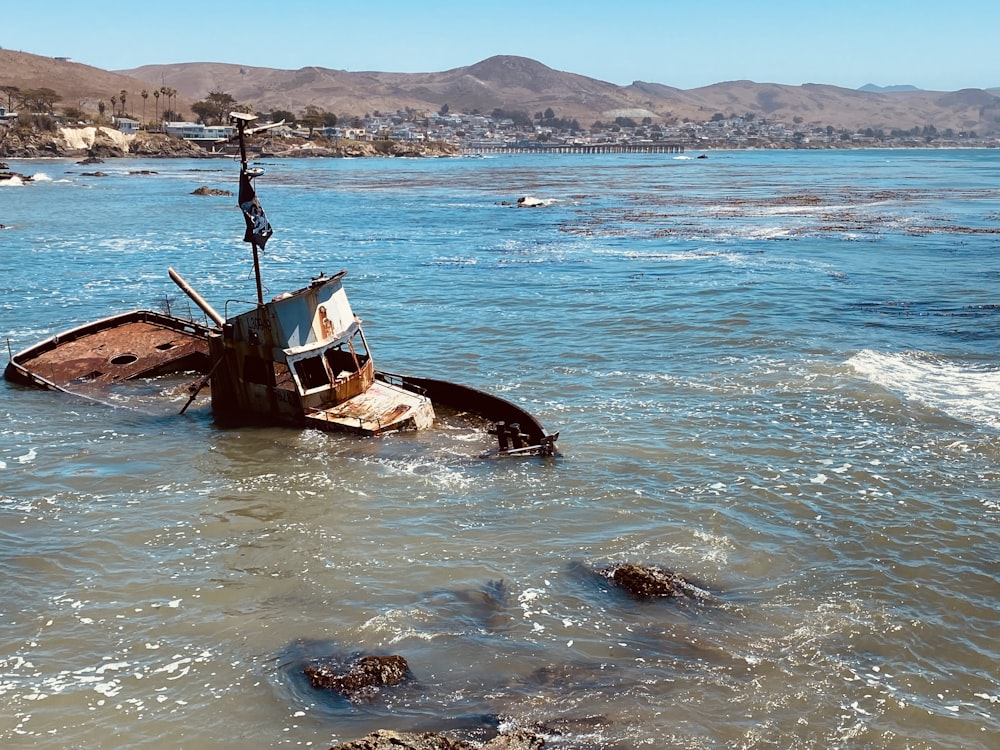 a boat in the water near a beach