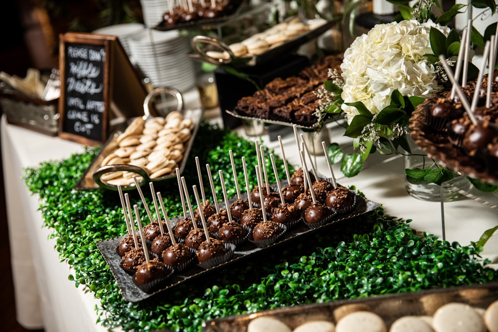 a table topped with lots of desserts and sweets