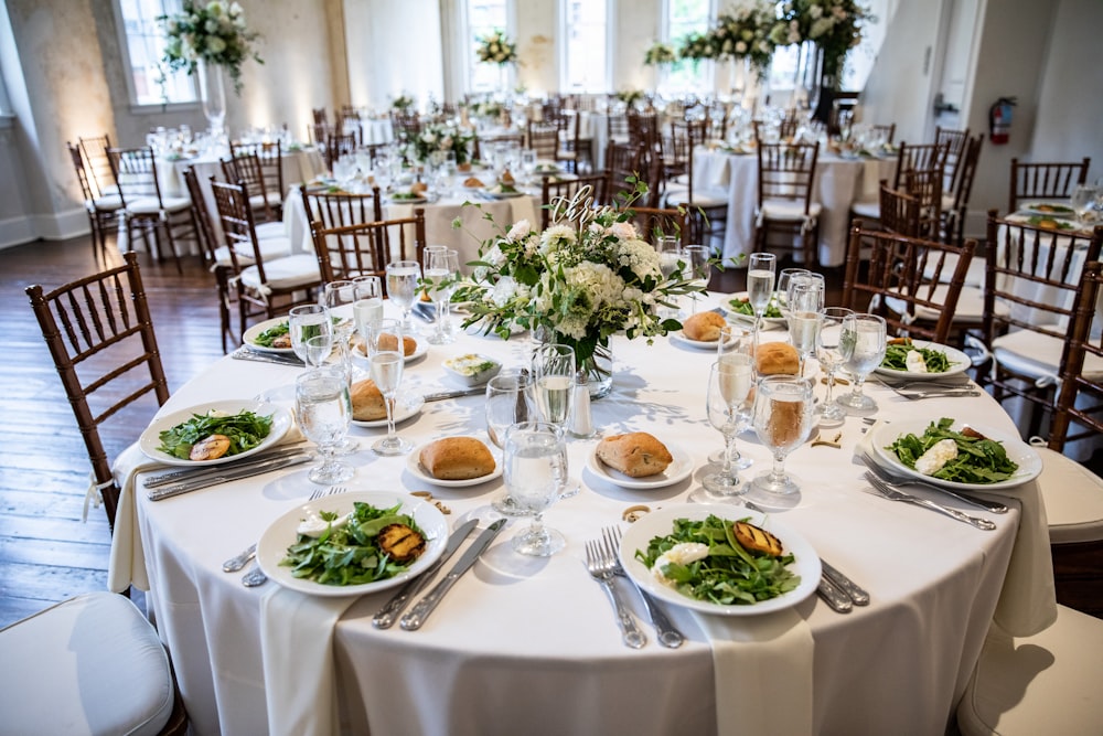 a table is set with plates of food and silverware