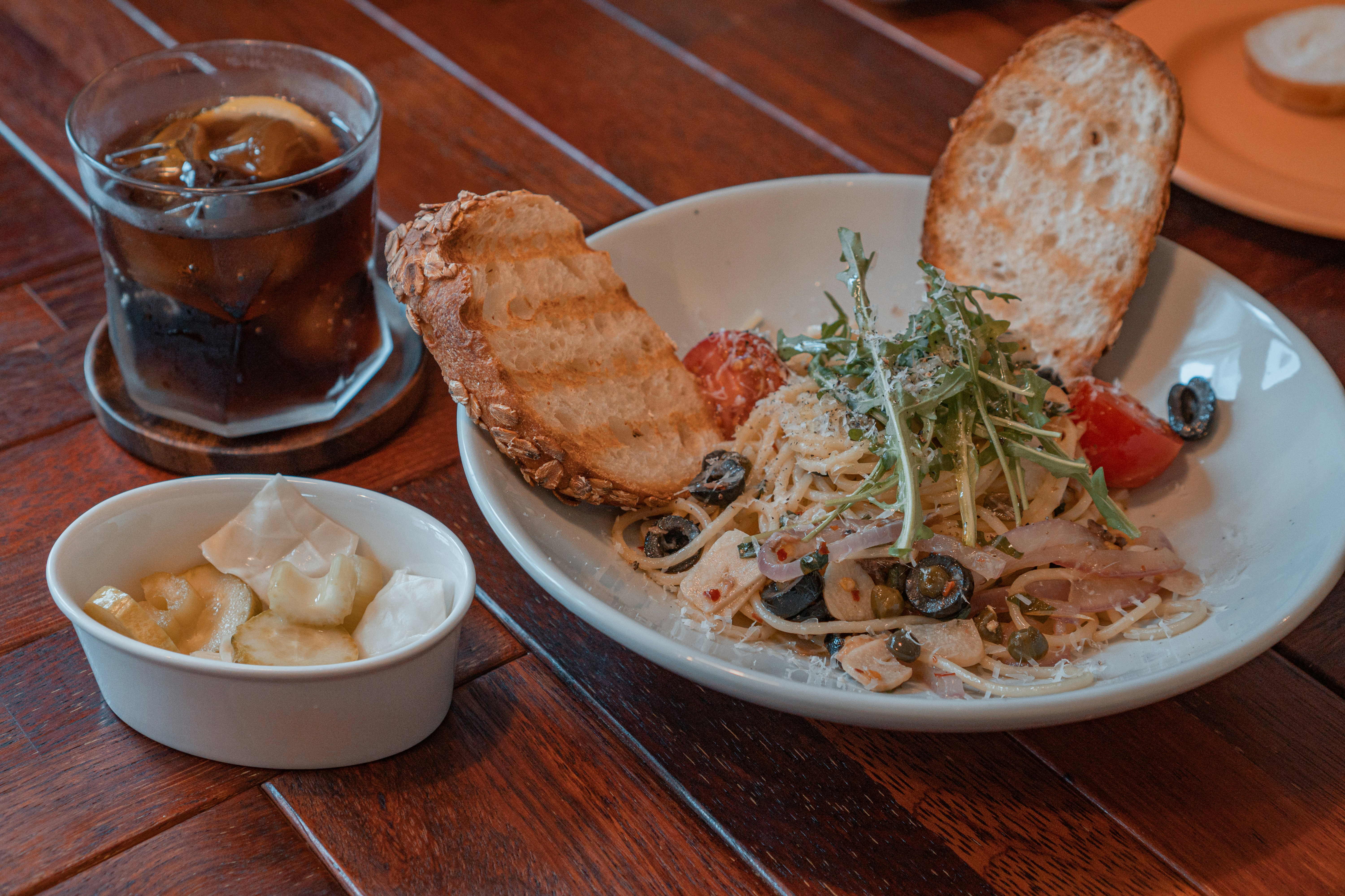 a plate of food and a cup of tea on a table