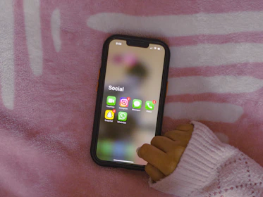 A social media campaign mockup displayed on a smartphone with pastel color accents.