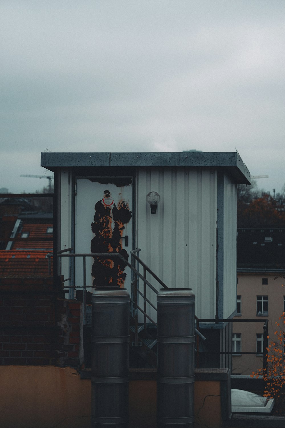 a couple of people standing on top of a building