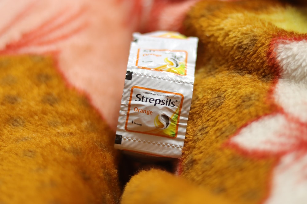 a close up of a package of food on a teddy bear