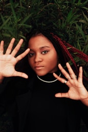 a woman with her hands in the air