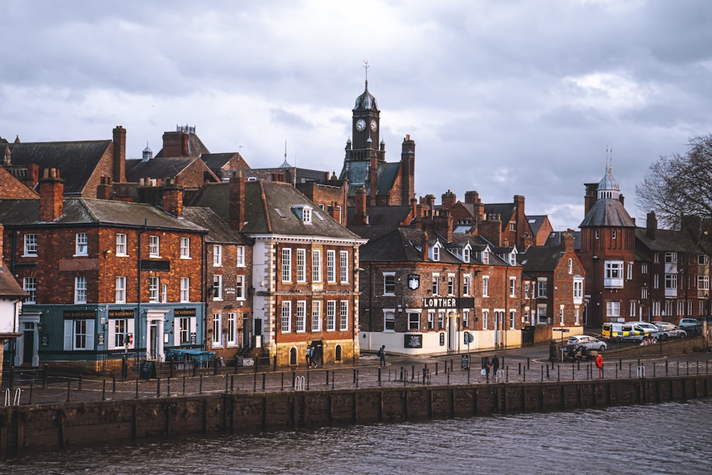 a group of buildings next to a body of water