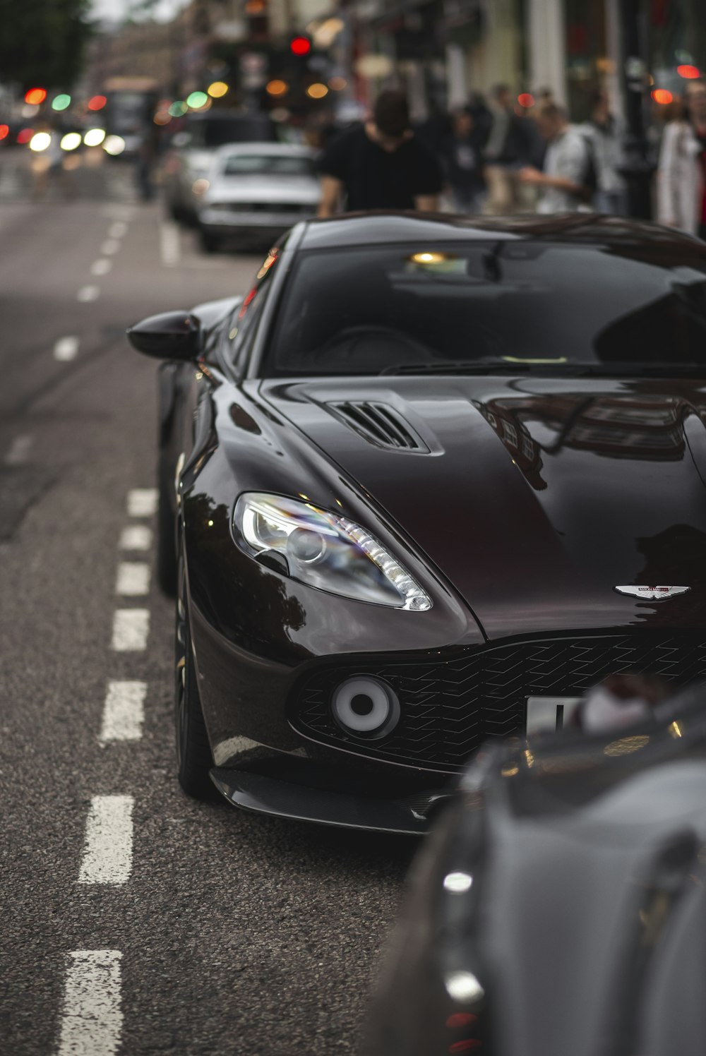 a black sports car parked on the side of the road