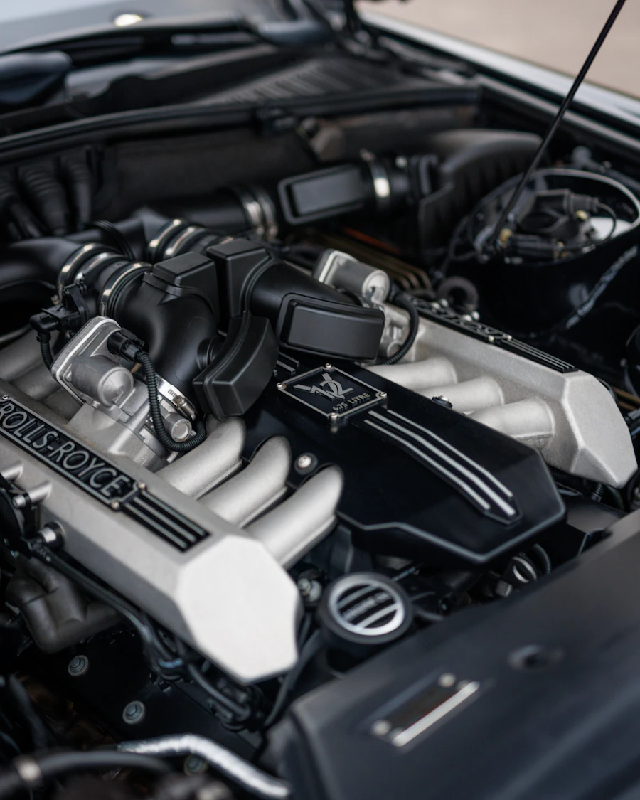 Car engine with hood raised, realistic engine bay