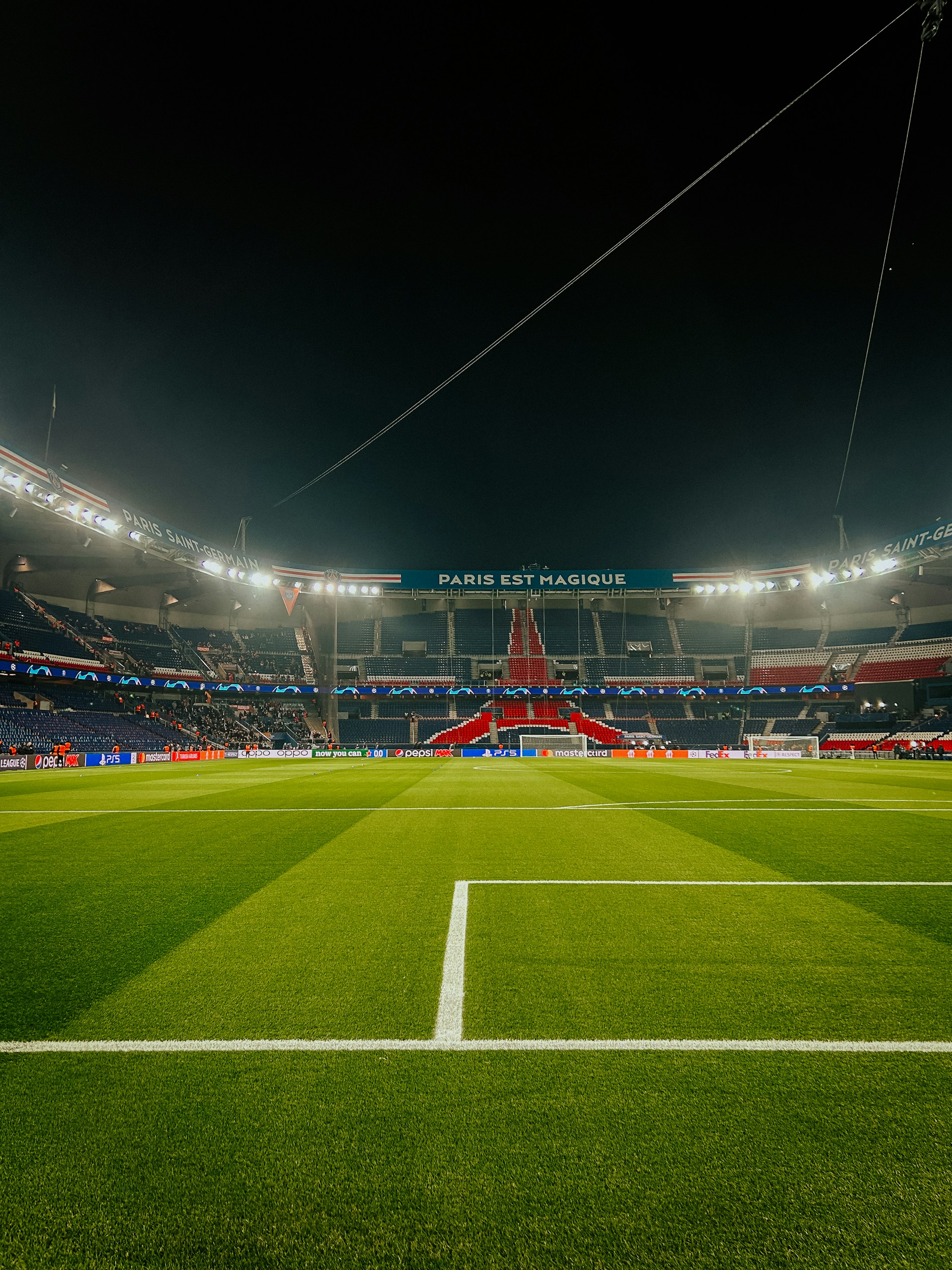 a soccer field at night with the lights on