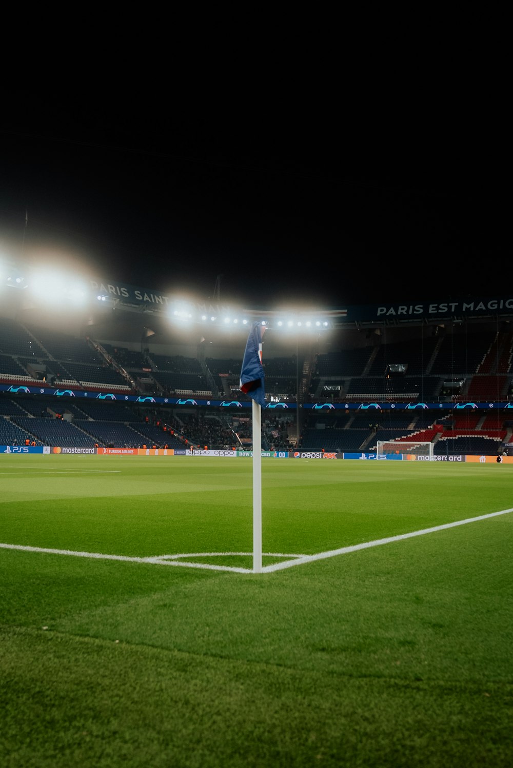 a soccer field with a goal post in the middle of it