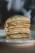 Close-up of a homemade cake slice with a warm, inviting background of a cozy kitchen.