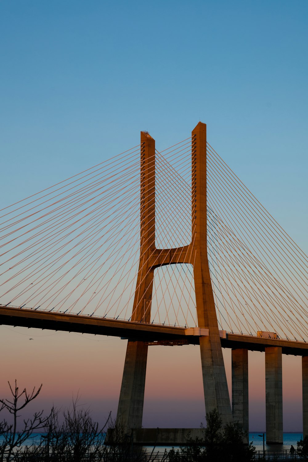 a large long bridge spanning over a body of water