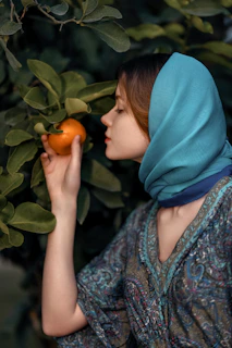 A peaceful scene of a Pakistani woman enjoying a relaxing aromatherapy session with calming earthy tones around.
