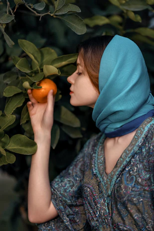 A peaceful scene of a Pakistani woman enjoying a relaxing aromatherapy session with calming earthy tones around.