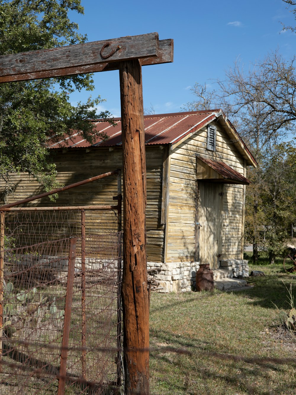 an old run down house with a rusty roof