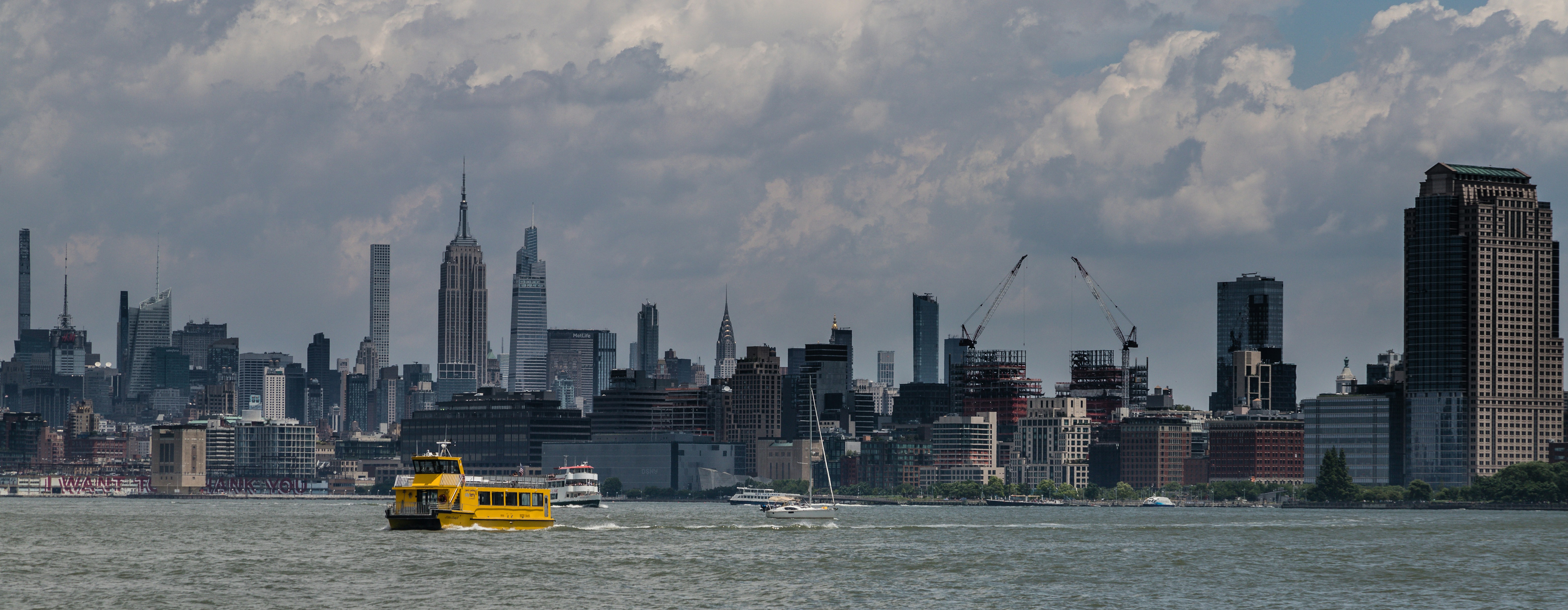 a yellow boat in a large body of water