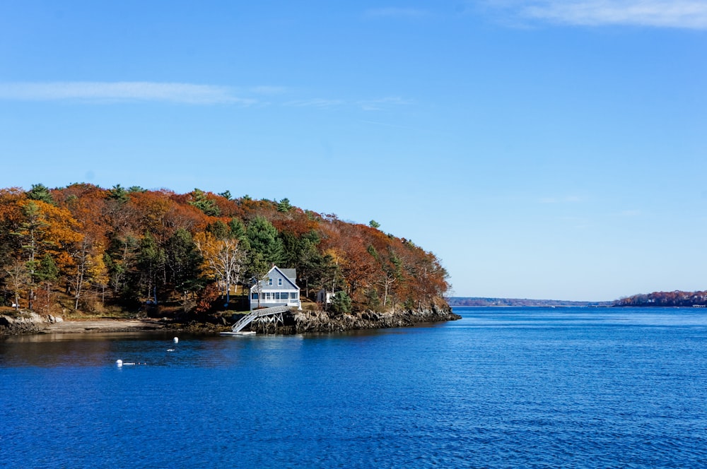 a house on a small island in the middle of a lake