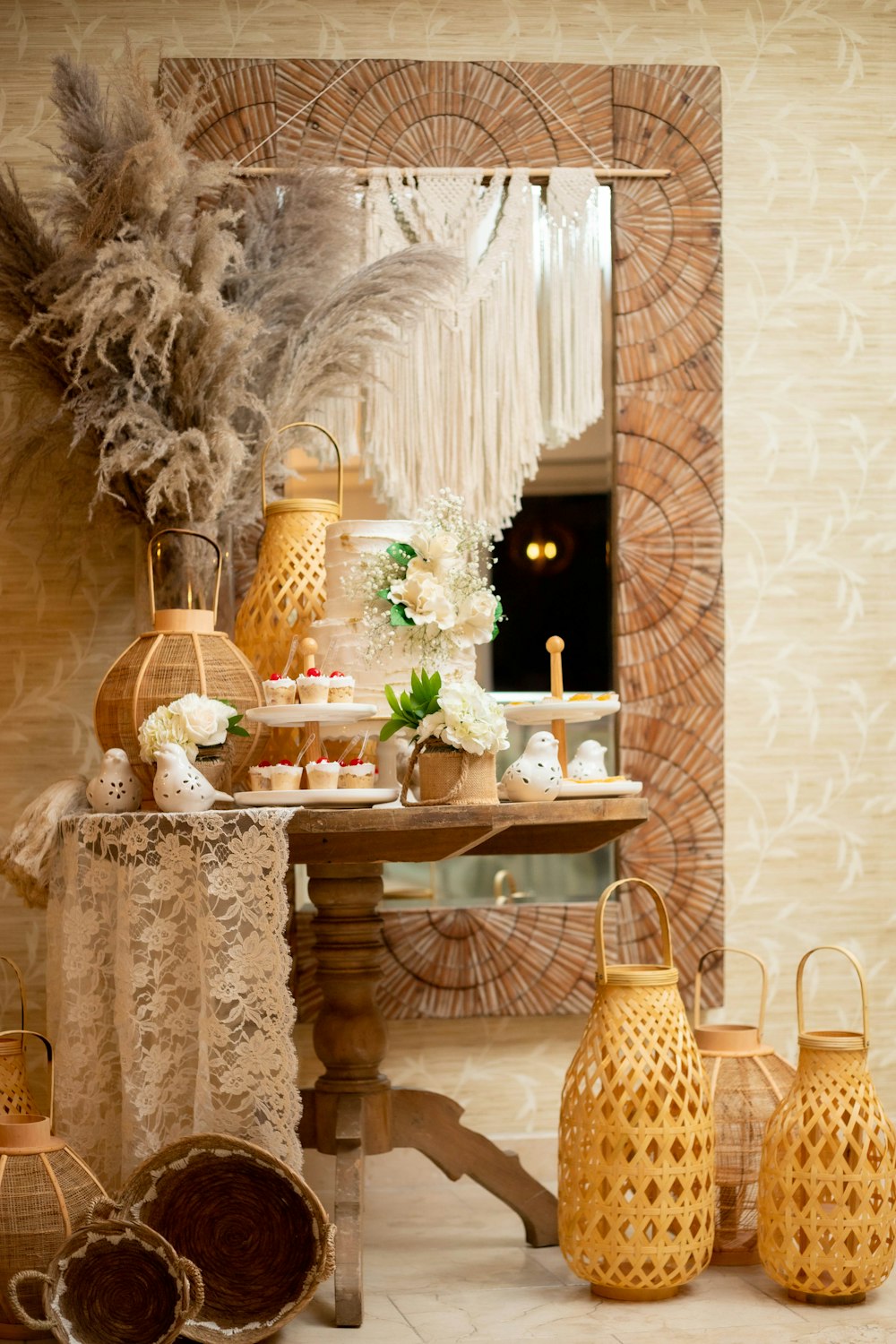 a table topped with lots of vases next to a mirror