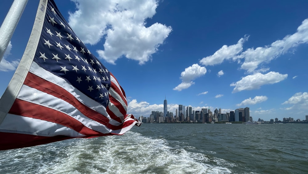 a large american flag on the back of a boat