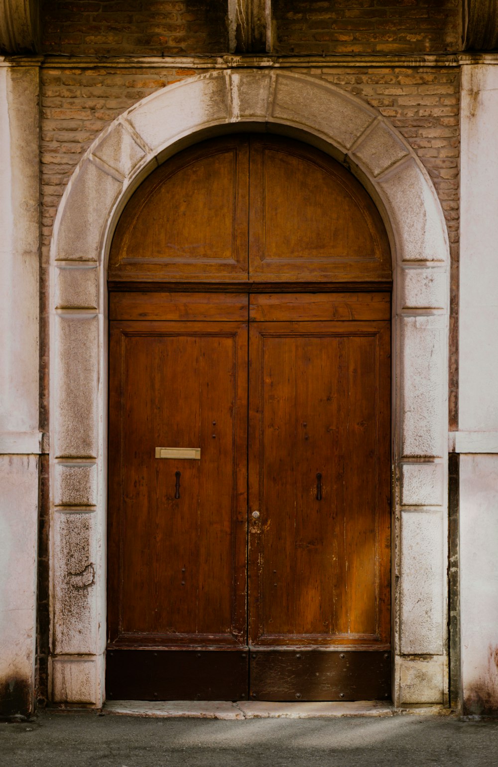 a couple of wooden doors sitting inside of a building