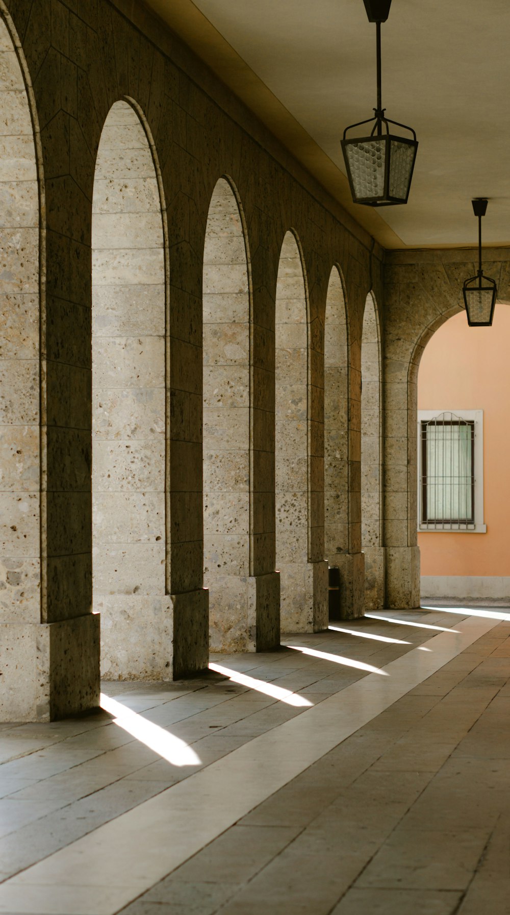 a row of stone pillars in a building