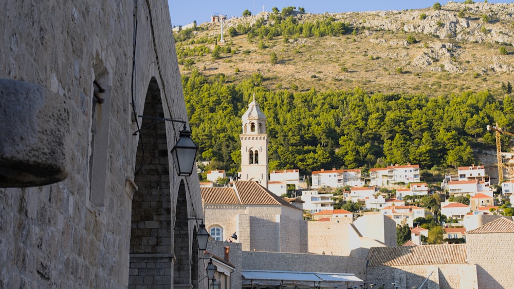 a clock tower towering over a small town