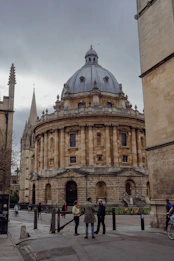 a group of people standing in front of a building