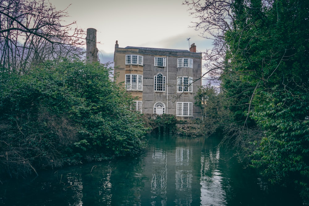 a house sitting on the side of a river