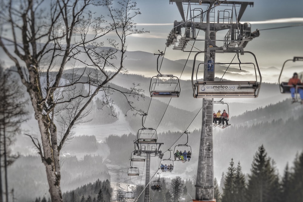 a group of people riding a ski lift